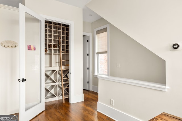 hallway with dark wood-type flooring