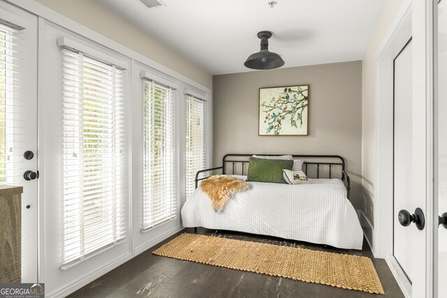 bedroom featuring dark hardwood / wood-style flooring