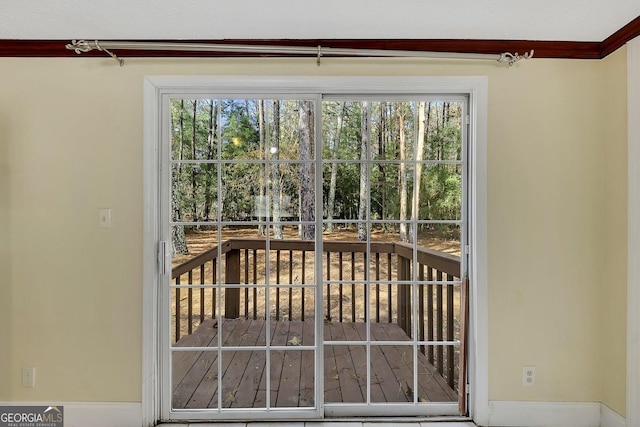 doorway to outside with crown molding