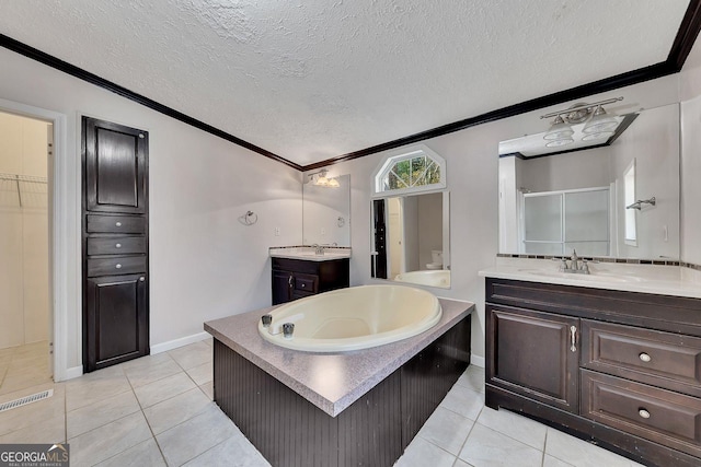 bathroom with tile patterned floors, vanity, ornamental molding, and a textured ceiling