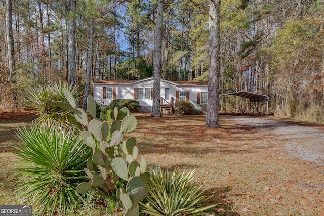 view of front of property featuring a carport