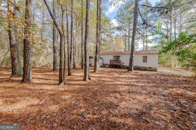 view of yard with a deck