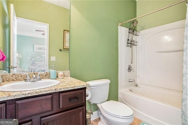 full bathroom featuring tile patterned floors, shower / tub combo with curtain, vanity, and toilet