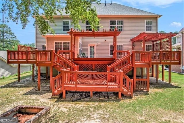 view of play area with a pergola, a yard, and a wooden deck