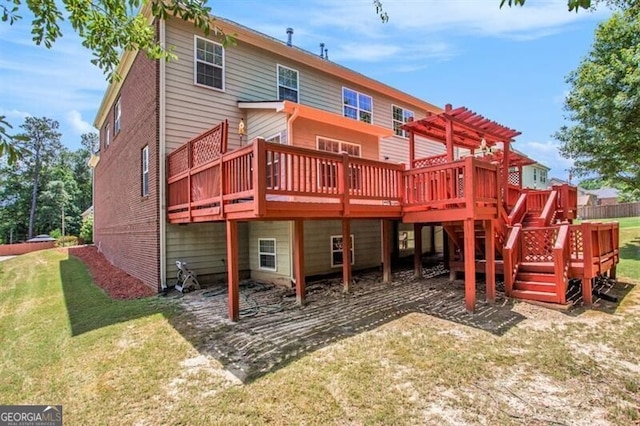 back of house with a pergola, a yard, and a wooden deck