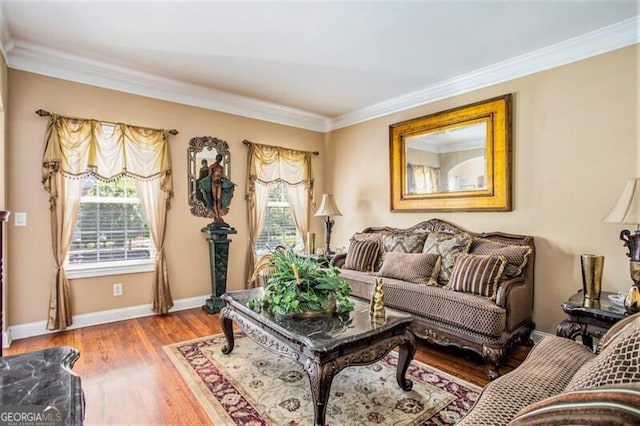 living area with ornamental molding and hardwood / wood-style flooring