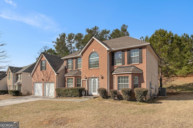 colonial inspired home with driveway, roof with shingles, a front lawn, central AC, and brick siding