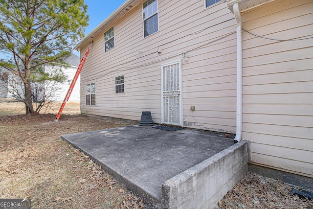 back of house with a patio