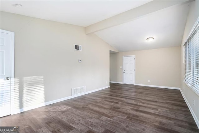 unfurnished room with vaulted ceiling with beams and dark hardwood / wood-style floors