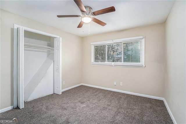 unfurnished bedroom with carpet, ceiling fan, and a closet