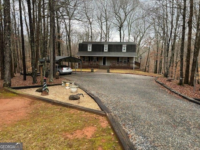 view of front of home with a carport and covered porch