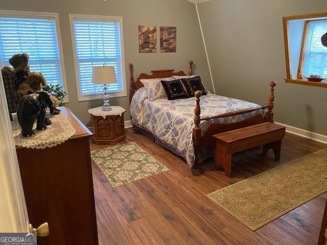 bedroom with hardwood / wood-style floors