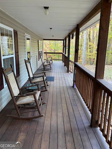 wooden deck featuring covered porch