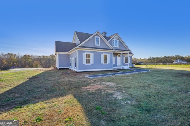 craftsman-style house featuring a front yard and a porch