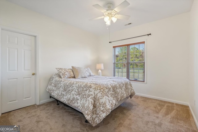 carpeted bedroom with ceiling fan