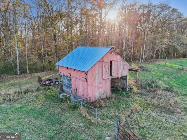 rear view of house with french doors and a yard