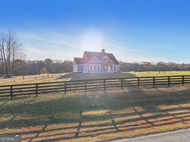 back of property featuring a lawn and a patio area