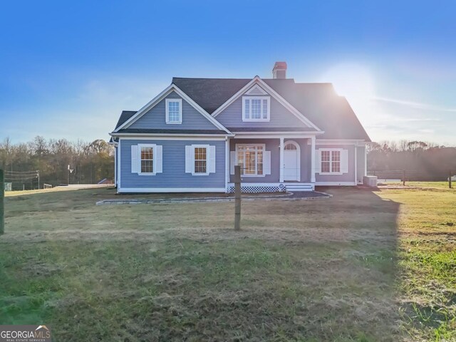 back of house featuring a yard