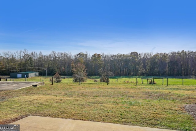 view of yard featuring a patio area and a rural view