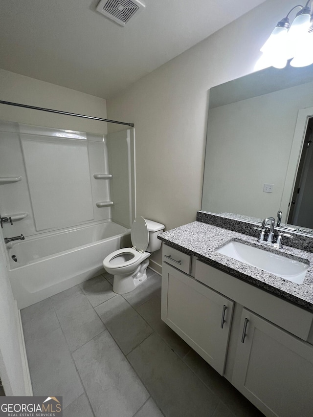 full bathroom with tile patterned floors, vanity, toilet, and washtub / shower combination