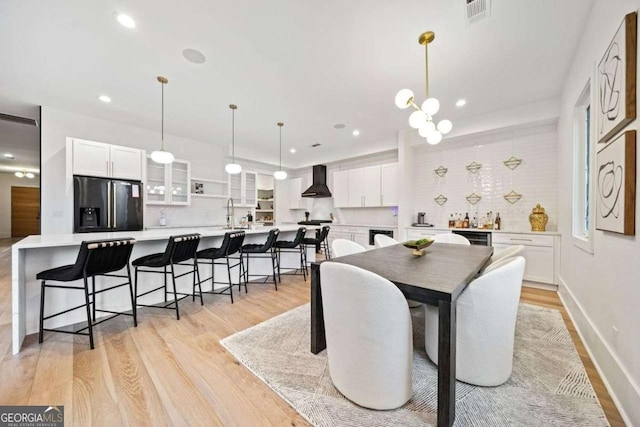 dining area with light hardwood / wood-style flooring