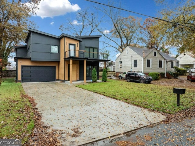 contemporary home featuring a garage, a front yard, and a balcony