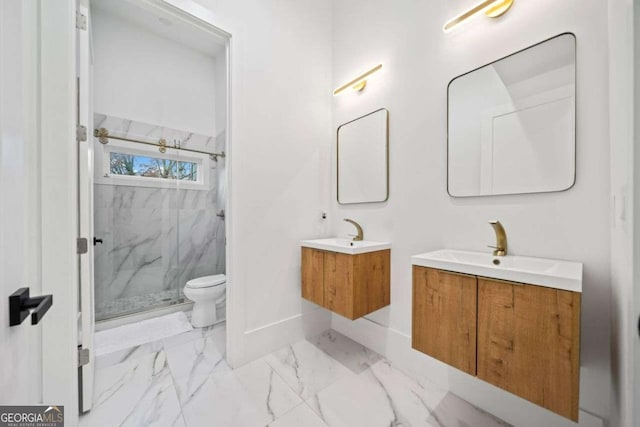 bathroom with vanity, toilet, and an enclosed shower