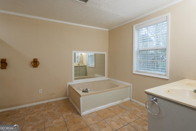 bathroom featuring vanity, tile patterned floors, ornamental molding, a textured ceiling, and a tub