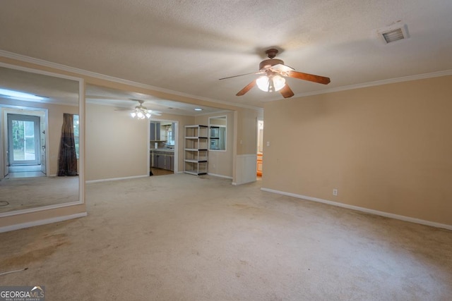 empty room with light carpet, ceiling fan, and ornamental molding