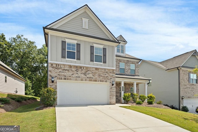 view of front facade with a garage and a front lawn