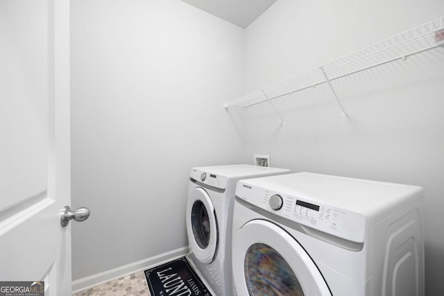 washroom featuring washer and clothes dryer