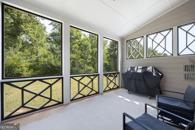 unfurnished sunroom with vaulted ceiling