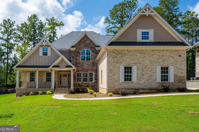 craftsman inspired home with a porch and a front yard