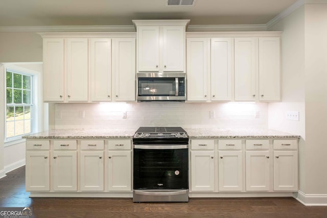 kitchen featuring backsplash, white cabinets, dark hardwood / wood-style floors, and appliances with stainless steel finishes