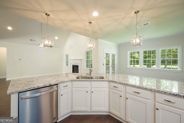 kitchen with dishwasher, sink, dark hardwood / wood-style floors, vaulted ceiling, and white cabinets