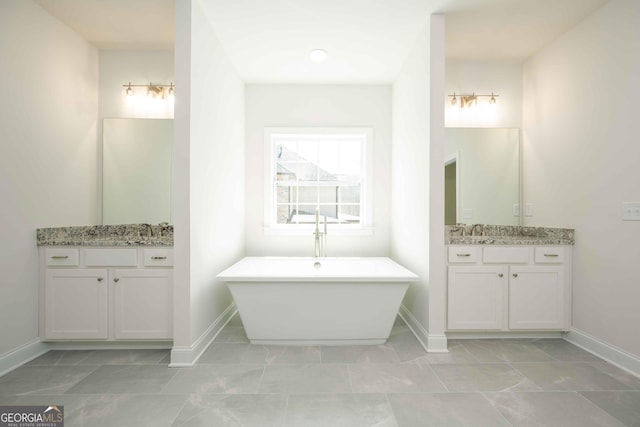 bathroom with vanity and a bathing tub