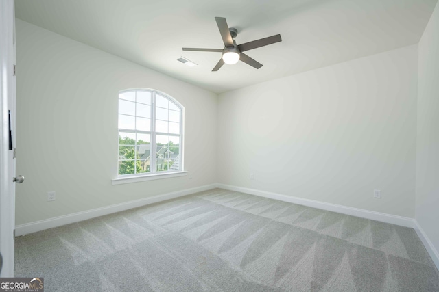 empty room with light carpet and ceiling fan