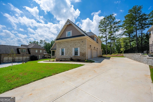 view of front of house featuring a front yard and a garage