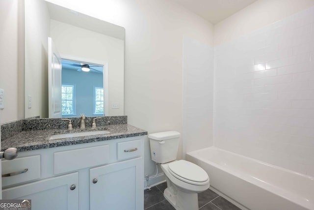 full bathroom featuring toilet, vanity, tile patterned floors, and tiled shower / bath