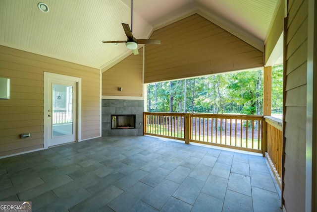 view of patio / terrace featuring a fireplace and ceiling fan