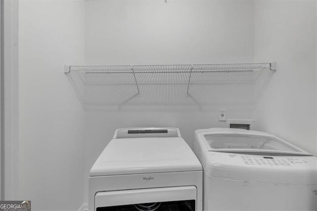 washroom with separate washer and dryer