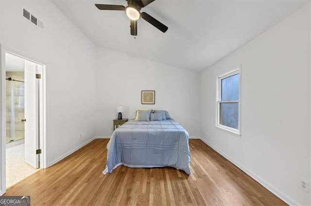 bedroom with ceiling fan and light hardwood / wood-style flooring