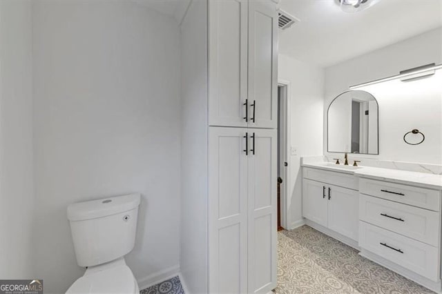 bathroom with vanity and toilet