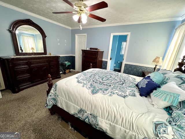 carpeted bedroom with a textured ceiling, ceiling fan, and crown molding