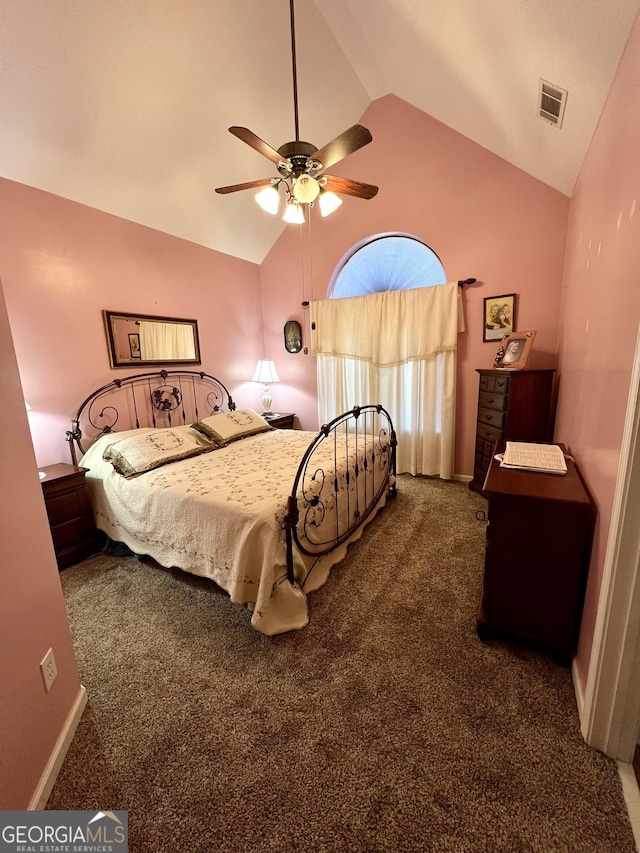 bedroom with dark colored carpet, vaulted ceiling, and ceiling fan