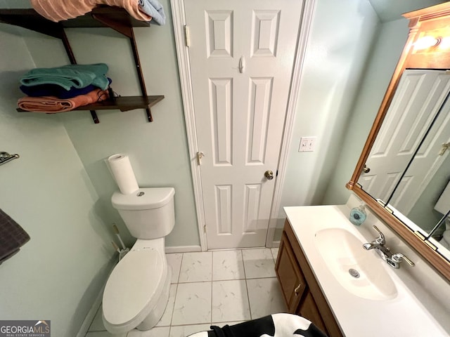 bathroom featuring vanity and toilet