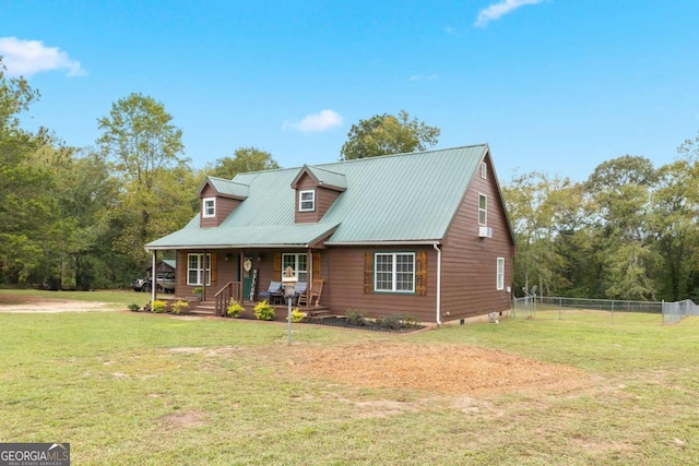 new england style home featuring a porch and a front lawn