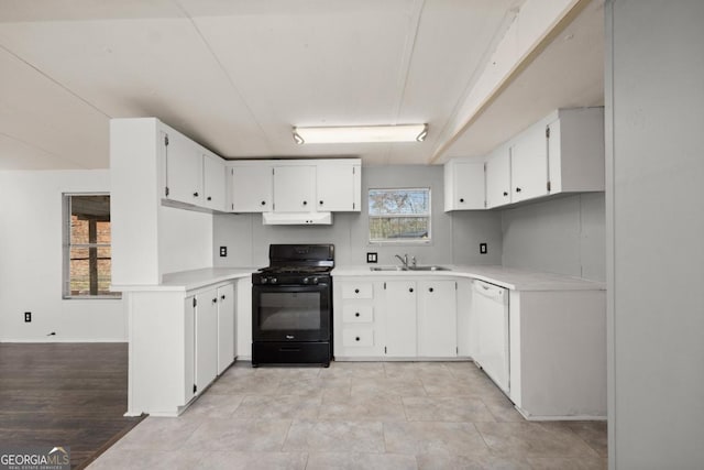 kitchen with black gas range, white cabinetry, sink, light hardwood / wood-style flooring, and white dishwasher