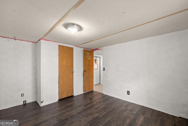 spare room featuring dark hardwood / wood-style floors