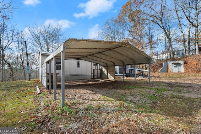 view of parking / parking lot with a carport